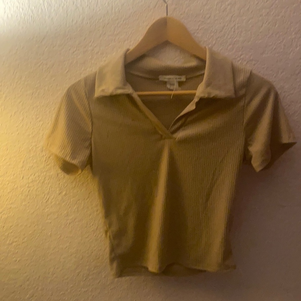 Cute cropped woman’s beige shirt